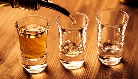 Why Do People Tap Their Shot Glass: A Toast to Tradition or Just a Tic?